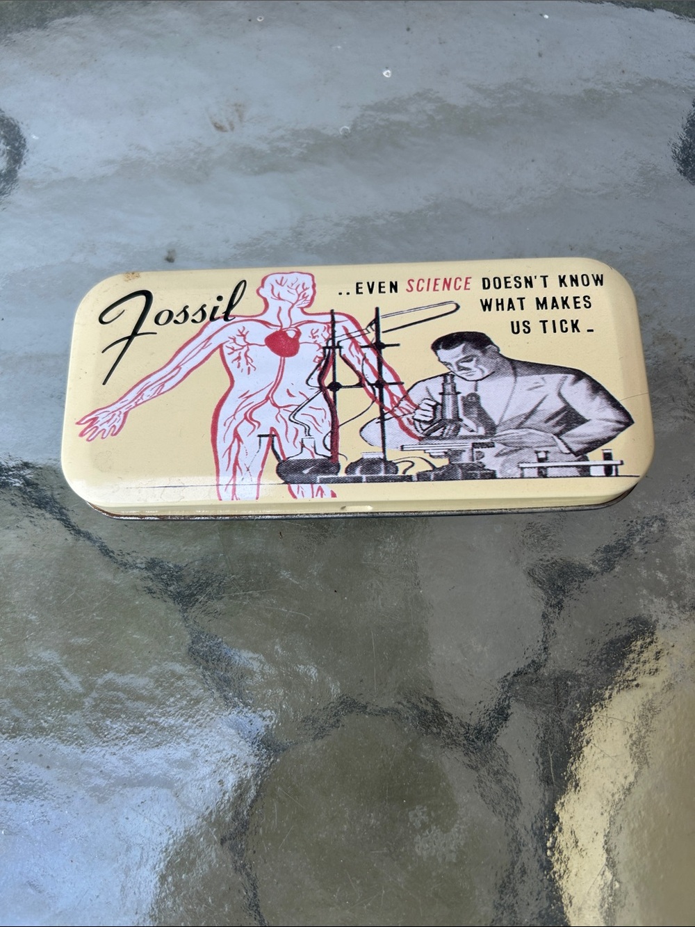 Fossil Cream Tin with Red & Black Science Illustration